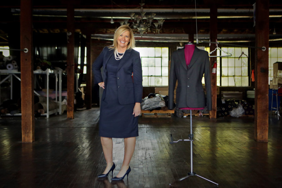 Johnna Beckham, CEO of Johnna Marie, maker of custom made suits for women, poses for a photo at the warehouse space where the suits are produced on Aug. 13, 2015 in St. Louis, Mo. (Huy Mach/St. Louis Post-Dispatch/TNS)