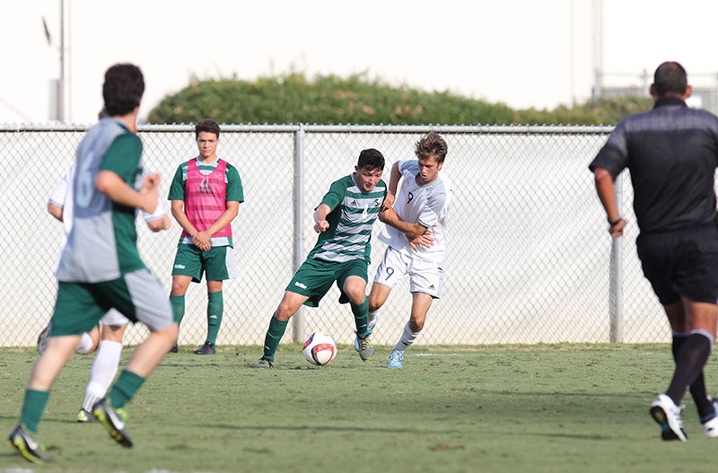 Ivan Ramirez takes UC Davis defender on Saturday, Oct. 24th, 2015 at Hornet Field. The Hornets won the game by a 1-0 final.