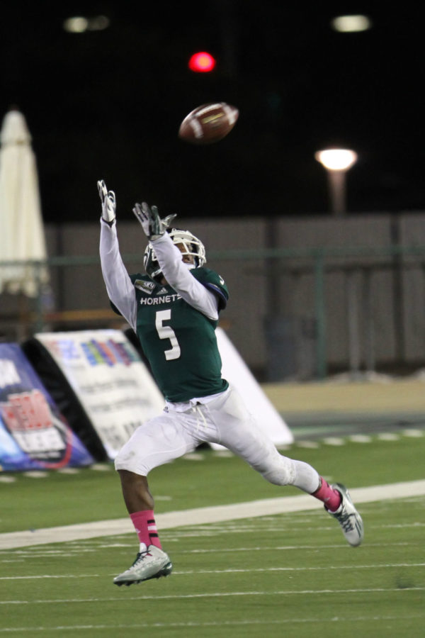 Sacramento State wide receiver Isiah Hennie extends to catch the ball against the University of Northern Colorado. Hennie lead the team with nine receptions and 95 receiving yards in a 27-20 loss to the Lumberjacks on Saturday Oct. 3, 2015, at Hornet Stadium.