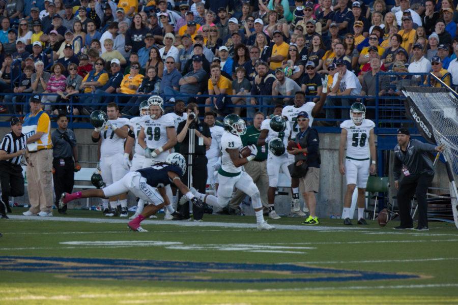 Hornets' running back Jordan Robinson runs the ball downfield against Montana State on Saturday, Oct. 10, 2015 at Bobcat Stadium. Robinson ran for 108 yards on 17 carries in the game. 