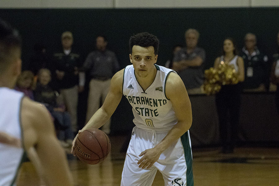 Marcus Graves looks for a pass to Jeff Wu during Sac States 79-76 loss to Montana State on Saturday, Feb. 6. 