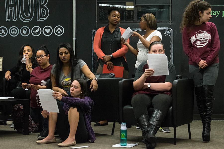 The cast of The Vagina Monologues goes over their lines while waiting to perform on Tuesday, Feb. 16 in the Wellness Hub. The event is being held on Thursday, Feb. 18 in the University Union Ballroom at 7:30 p.m.