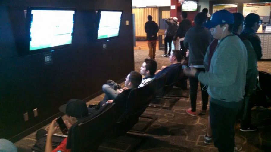 Students gather in the Games Room to join in on the FIFA 16 tournament. 