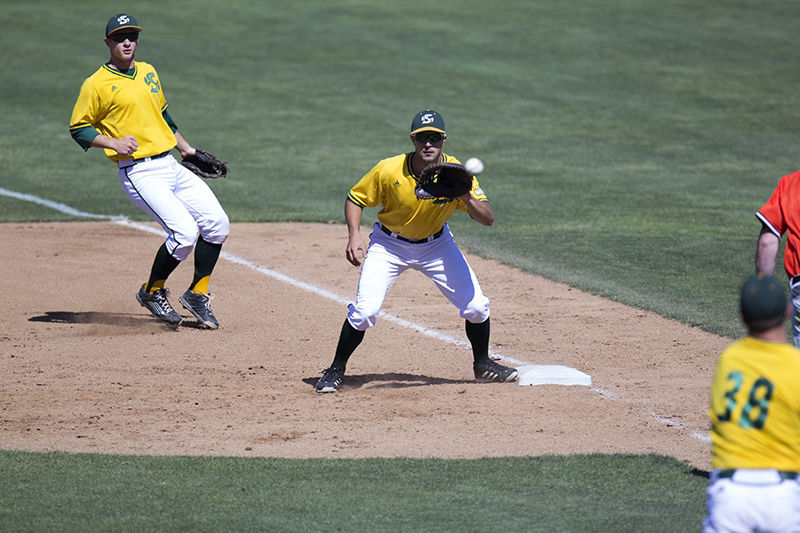 Freshman Vinny Esposito catches a throw from pitcher Jake Stassi to get an out during a game against the University of Pacific on Tuesday, April 14, 2015 at John Smith Stadium.