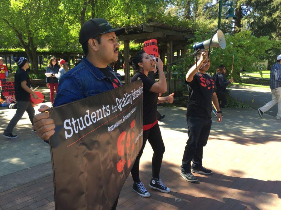 Members of Students for Quality Education protesting at Sac State with a megaphone after the California Faculty Associations announcement regarding the looming strike and pay dispute with the CSU, Monday, March 28. 