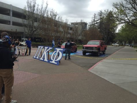 Pi Kappa Phi displays two junk cars outside the Hornet Bookstore on Thursday, March 3. Students could donate $3 to smash these cars with sledgehammers as part of the fraternity's