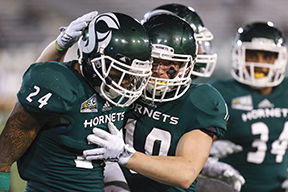 Anthony Payne celebrates with Austin Clark during the game against Idaho State on Saturday, Oct. 24, 2015. Payne had three tackles and one of the teams four interceptions in a 38-13 win against the Bengals.