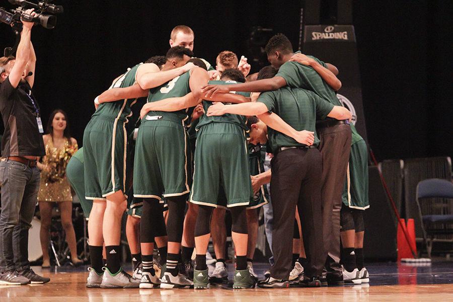 The mens basketball team huddles up before the game against Montana State in the Reno Events Center, Tuesday, Mar. 8.