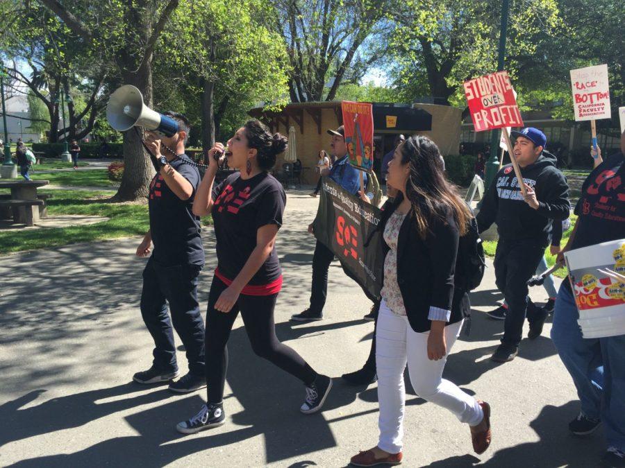 Members of Students for a Quality Education protesting at Sac State with a megaphone after the California Faculty Associations announcement regarding the looming strike and pay dispute with the CSU, Monday, March 28. 