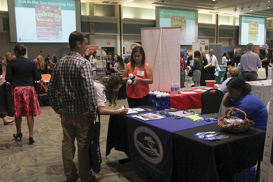 Students and employers converse about possible job opportunities at the Educator Recruitment Expo in the University Union Ballroom on Tuesday, April 19.