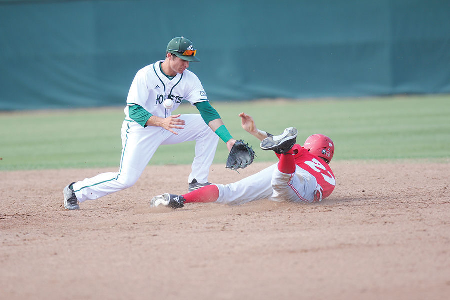 Brandon Hunley tries to tag out the base runner against New Mexico at John Smith Field, Tuesday, Mar. 29. Hunley went 1 for 4 and had two RBI’s in a 12-3 loss.