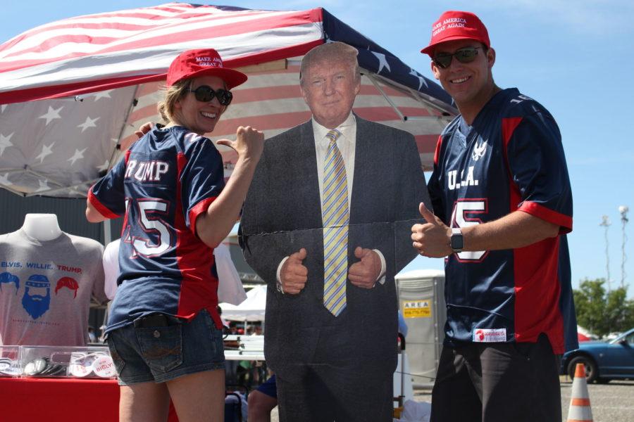 Trump supporters Cathy Landtroop and Austin Taylor pose with their life-size cardboard cutout of the presumptive Republican nominee at the rally, Wednesday, June 1.