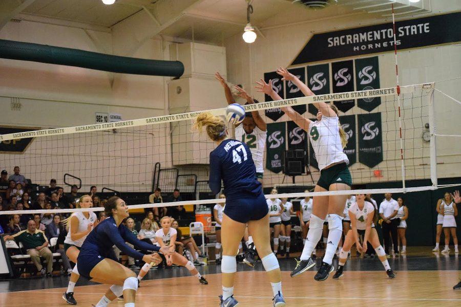 Junior+Shannon+Boyle+and+sophomore+Brie+Gathright+block+a+shot+against+the+University+of+Nevada%2C+Reno+on+Sept.+17+at+Colberg+Court.+%28Photo+by+Rich+Merrill%29