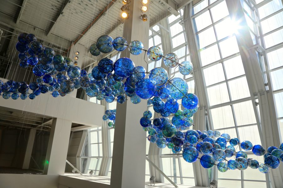 Artist Bryan Valenzuela installs his first sculpture “Multitudes Converge” by using 400 glass globes and 109 steel rods to depict the convergence of the Sacramento and American rivers.
(Courtesy of Joan Cusick Photography)