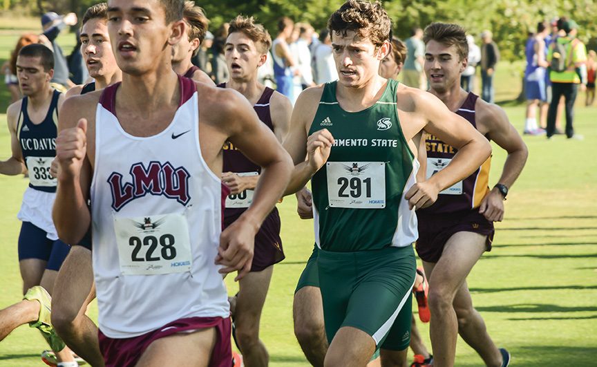 Junior Sam Scheuer runs in the lead pack of the mens 8k cross country race at the Capital Cross Challenge at Haggin Oaks Golf Complex on Saturday, Oct. 1, 2016.  Scheuer set a personal best in the mens 8k at 24:55. (Photo by Matthew Dyer)