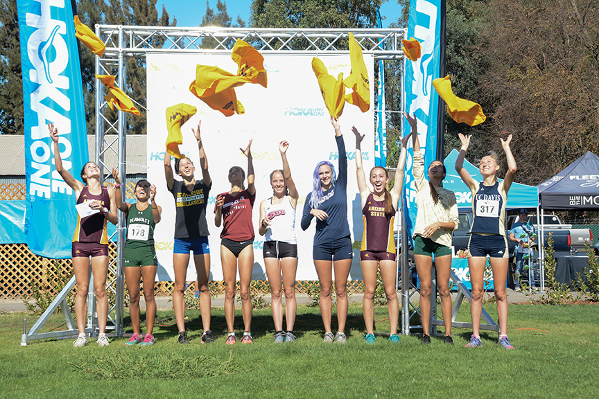 Sophomore Amy Quinones, second from the far right, poses for a picture with the rest of the top finishers of the women's 6k cross country race at the Capital Cross Challenge at Haggin Oaks Golf Complex on Saturday, Oct. 1, 2016. (Photo by Matthew Dyer)