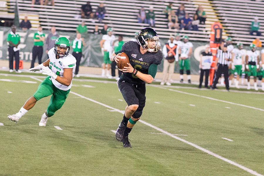 Sacramento State sophomore quarterback Nate Ketteringham looks for a receiver against the North Dakota defense on Oct. 8, 2016 at Hornet Stadium. (Photo by Michael Zhang)