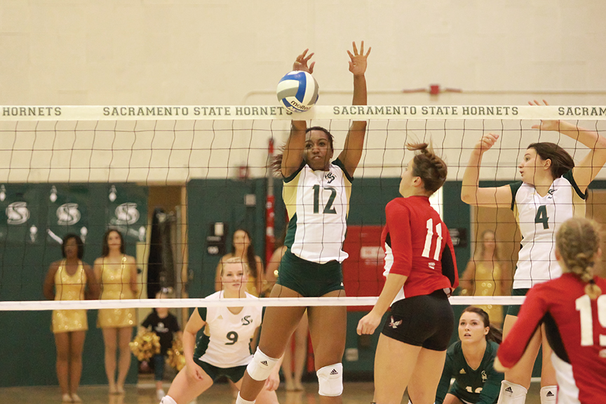 Sacramento State sophomore middle blocker Brie Gathright blocks Sophie Miller of Eastern Washington at Colberg Court on Saturday, Oct. 22. (Photo by Matthew Dyer)