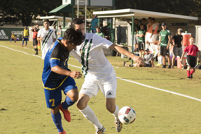 Sacramento State midfielder Christian Webb attempts to get passed UC Riverside midfielder Emilio Huerta at Hornet Field on Oct 8. (Photo by Joseph Daniels)