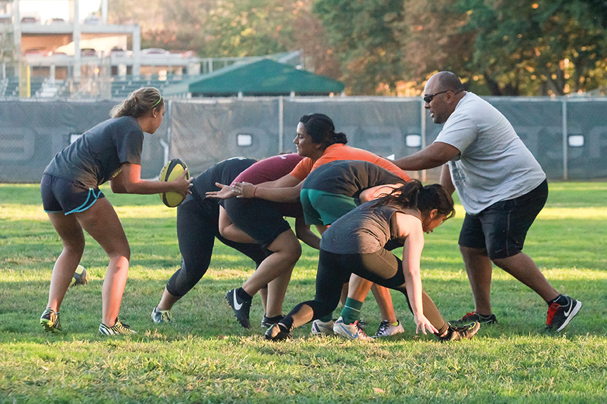 Sacramento State  head coach Inoke Waqavesi guides the womens rugby club during drills next to Hornet Field on Oct. 20. The club has made a return to competing at the Division II level. (Photo by Matthew Dyer)