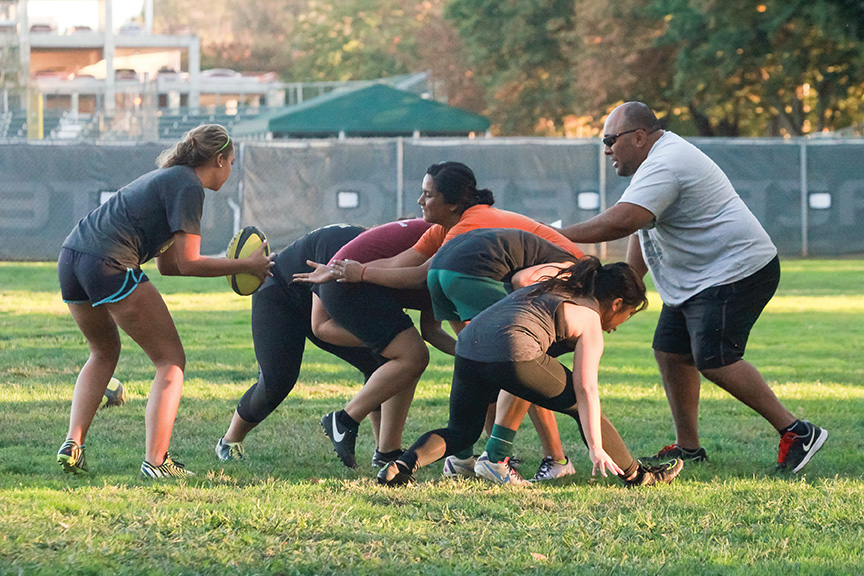 Sacramento State  head coach Inoke Waqavesi guides the women's rugby club during drills next to Hornet Field on Oct. 20. The club has made a return to competing at the Division II level. (Photo by Matthew Dyer)