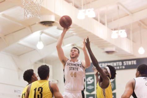 Sacramento State senior center Eric Stuteville attempts a shot in the paint against Northern Arizona on March 5, 2016 in the Hornets Nest. (Photo by Matthew Dyer)