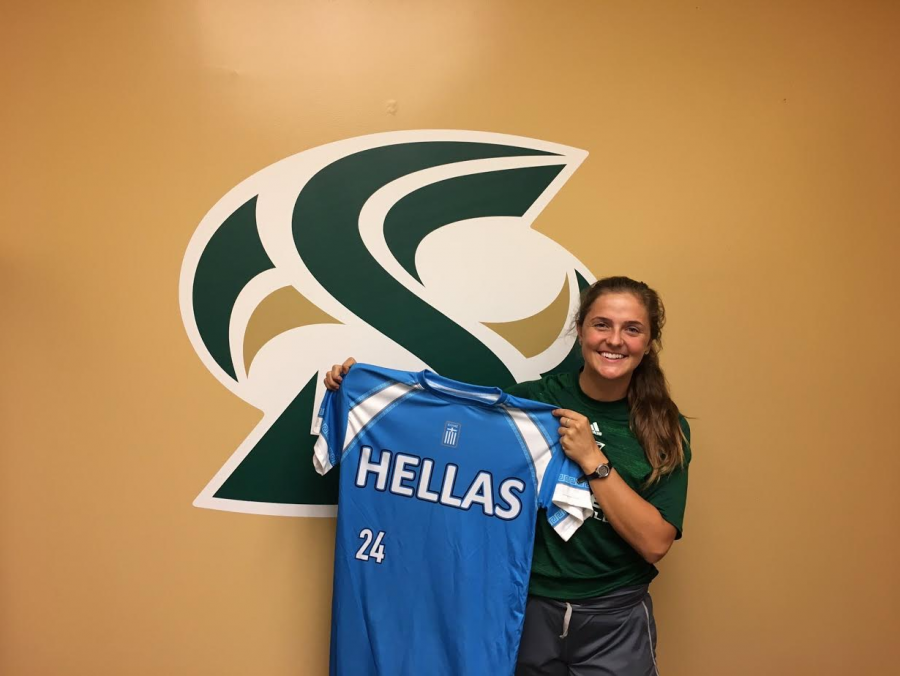 Sacramento State senior softball catcher Nikki Gialketsis holds up her Greek national team jersey on Sept. 28, 2016. (Photo by Will Moon)