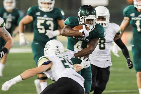 Sacramento State senior running back Demetrius Warren avoids a tackle from a Cal Poly defender on Saturday at Hornet Stadium. Warren accumulated 79 rushing yards in the 47-59 loss to Cal Poly.