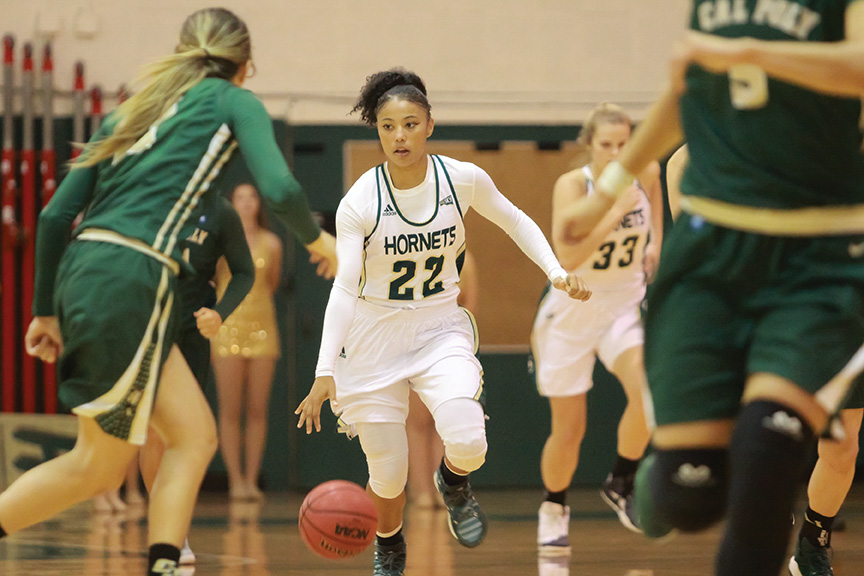 Sacramento State junior guard Maranne Johnson dribbles down the court against Cal Poly at the Hornets Nest on Sunday, Nov. 13. (Photo by Matthew Dyer)