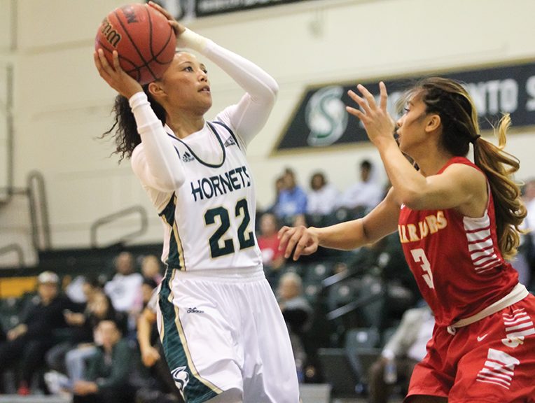 Sacramento State junior guard Maranne Johnson shoots the ball in the paint against Stanislaus State at the Nest on Tuesday, Nov. 29. (Photo by Matthew Dyer)