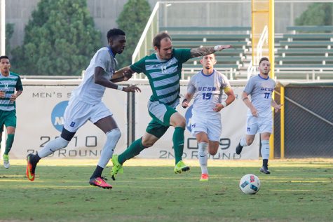 Sacramento State senior forward Nate Nugen battles University of California Santa Barbara's Lamar Batista for the ball at Hornet Field on Oct. 26. (Photo by Matthew Dyer)