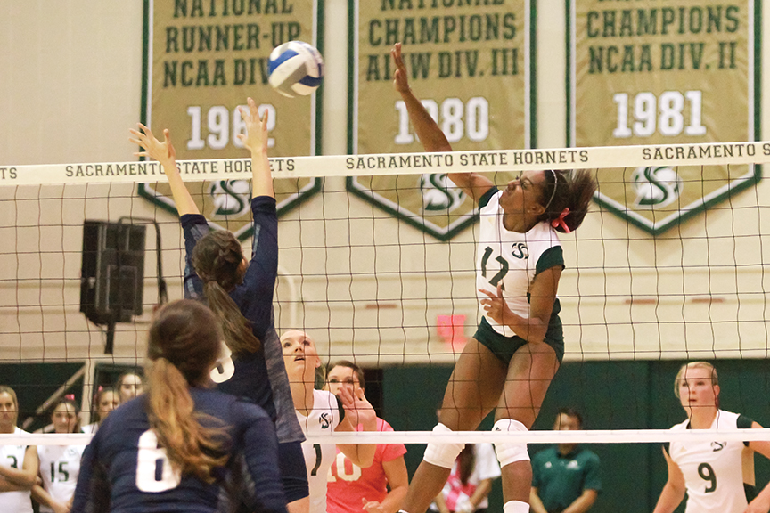 Sacramento State sophomore midblocker Brie Gathright spikes the ball against Northern Arizona at Colberg Court on Oct. 27. (Photo by Matthew Dyer)