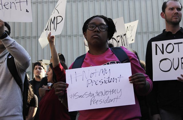 Sac State student Ashley Goins protests the election of Donald J. Trump at the Library Quad on Nov. 9, 2016.