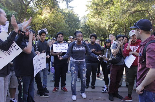 Sac State student Donna Colbert asks students to “stay involved” during an anti-Trump protest in the Library Quad on Nov. 9, 2016.