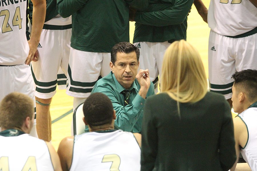 Sacramento State men's basketball coach Brian Katz talks strategy with his team during a timeout at the Nest against UC Merced on Dec. 3, 2016. (Photo by Matthew Dyer)