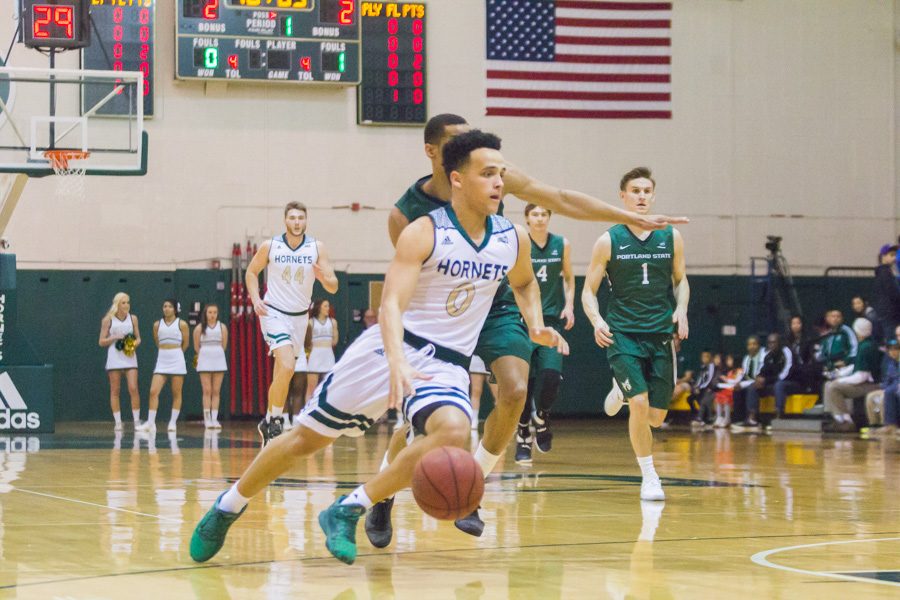 Sacramento State junior guard Marcus Graves drives past a Portland State defender for a layup at the Nest, Jan. 28.  Graves had 12 points, eight assists and five rebounds in an 80-77 overtime victory. (Photo by Matthew Dyer)