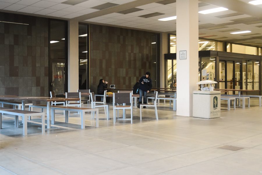 The Library installs 49 permanent sets of tables and chairs in the breezeway in December 2016. (Photo by Matthew Dyer)