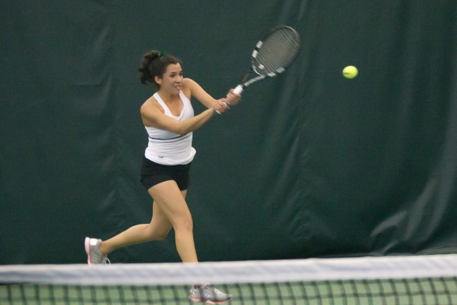 Sacramento State junior Ana Loaiza Esquivias backhands the ball for a point in her singles match against Galina Bykova of Fresno State at Spare Time Indoor Tennis Center, Sunday, Jan. 22. (Photo by Matthew Dyer)