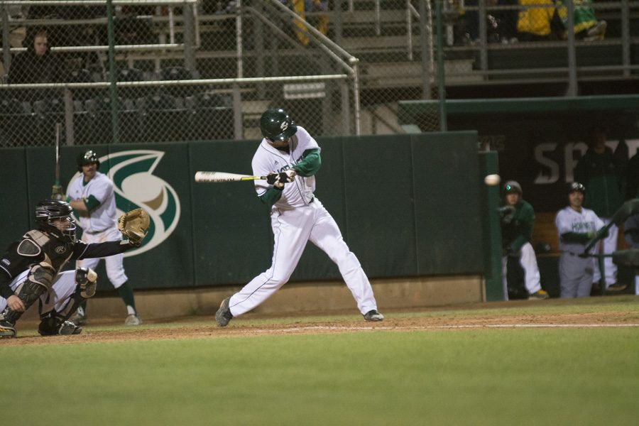 Sacramento State senior shortstop Trent Goodrich swings and makes contact with the ball against Northern Kentucky Friday at John Smith Field. (Photo by Myha Sanderford)