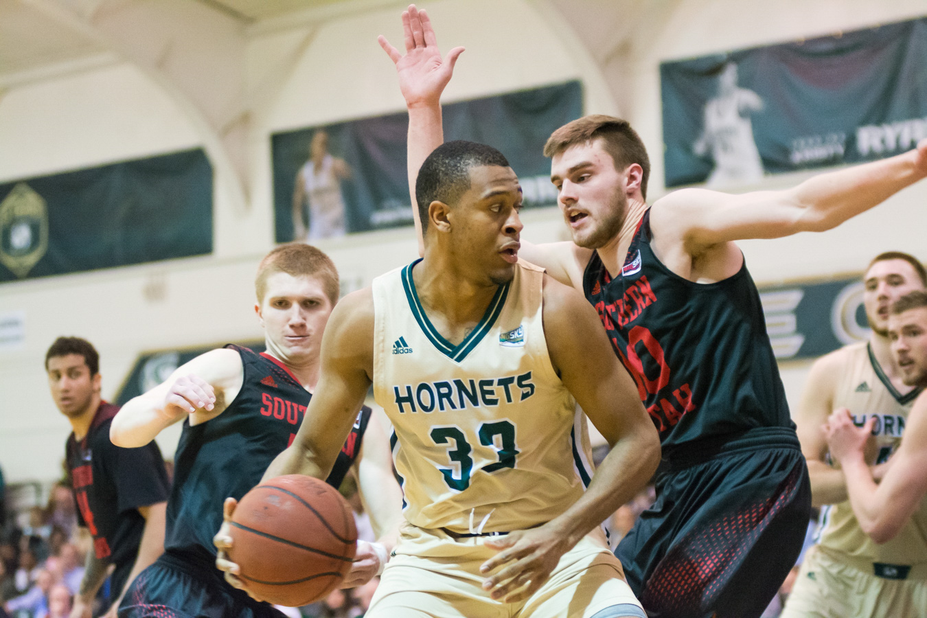 Sacramento State senior forward Nick Hornsby backs down Jacob Calloway of Southern Utah in the post Feb. 26 at the Nest. (Photo by Matthew Dyer)