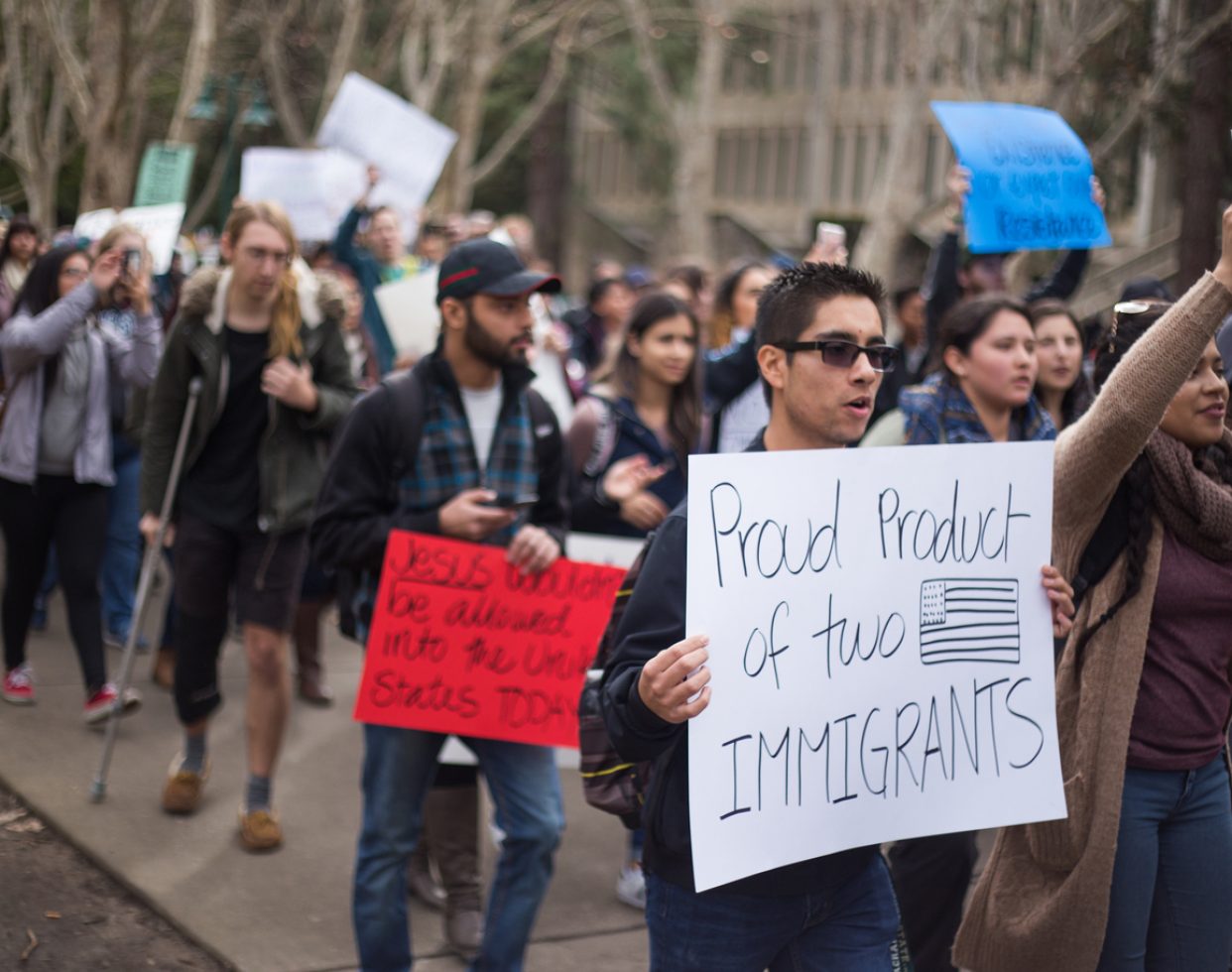 Demonstrators march through the Sacramento State campus during a #NoBanNoWall protest on Feb. 2, 2017. An estimated 300 people attended.