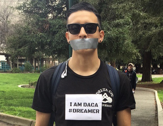 Sacramento State student Everardo Chavez wears signs on his chest identifying himself as a Deferred Action for Childhood Arrivals (DACA) participant as part of a silent protest on campus on Thursday, Feb. 16. Chavez was protesting as part of A Day Without Immigrants, a nationwide protest against President Donald Trumps immigration policies. (Photo courtesy of Pedro Cisneros)