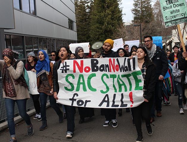 Demonstrators march through Sacramento State during a #NoBanNoWall protest on Feb. 2, 2017. (Photo by Barbara Harvey)