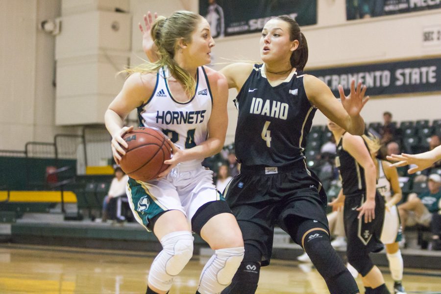 Sacramento State senior forward Gretchen Harrigan spins away from Brooke Reilly of Idaho at the Nest on Saturday.  Harrigan had a game-high 23 points, five rebounds and two assists in a 72-58 loss. (Photo by Matthew Dyer)