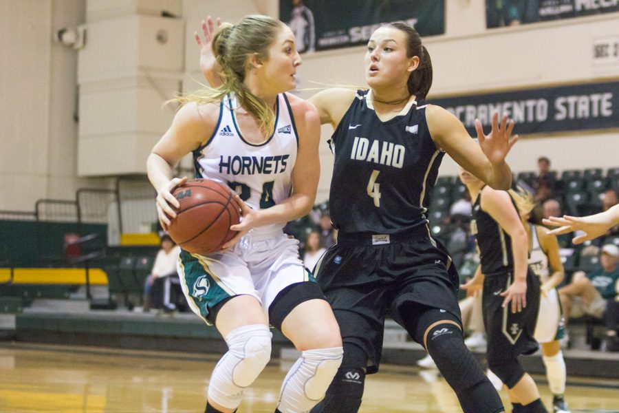 Sacramento+State+senior+forward+Gretchen+Harrigan+spins+away+from+Brooke+Reilly+of+Idaho+at+the+Nest+on+Saturday.++Harrigan+had+a+game-high+23+points%2C+five+rebounds+and+two+assists+in+a+72-58+loss.+%28Photo+by+Matthew+Dyer%29