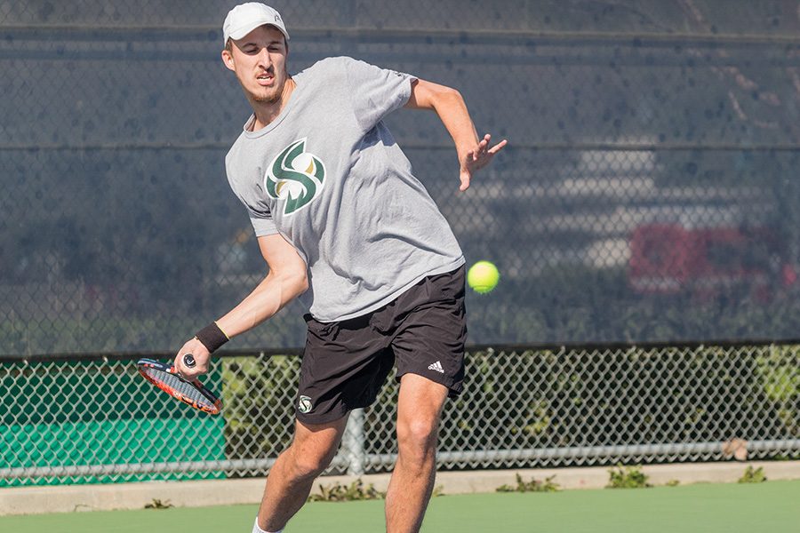 Sacramento State senior Kasparas Zemaitelis prepares to hit the ball during play against UC Davis Saturday at the Marya Welch Tennis Center. (Photo by Matthew Nobert)