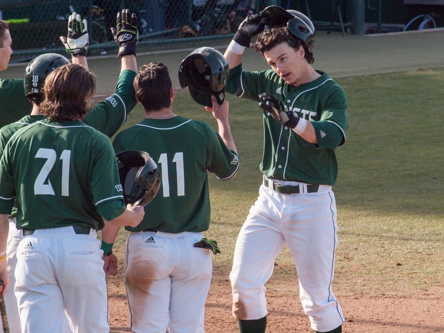 Sacramento State sophomore right fielder James Outman celebrates with teammates after he hits a home run against Northern Kentucky Saturday at John Smith Field. (Photo by Andro Palting)