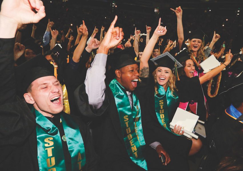 Graduates put their stingers up during the spring 2016 commencement. The spring 2017 commencement was a source of controversy after issues with venue confirmation and available tickets. (Photo courtesy of Jessica Vernone / Sacramento State)