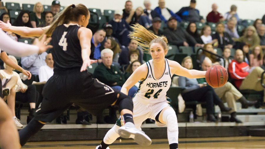 Sacramento State senior forward Gretchen Harrigan passes the ball to a teammate against Idaho at the Nest on Feb. 4. Harrigan is one of three seniors who combined to miss a total of 52 games in the 2016-17 season. (Photo by Matthew Dyer)