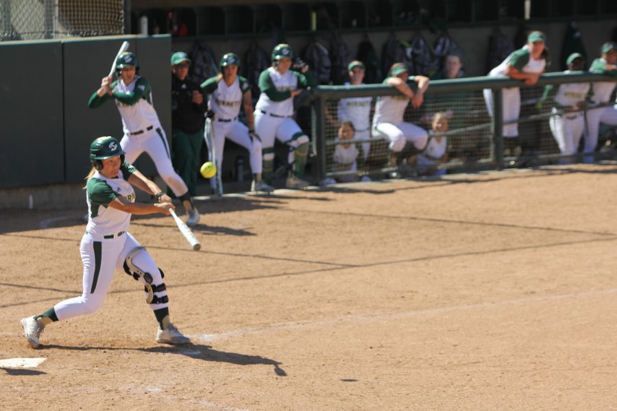 Sacramento State freshman Suzy Brookshire swings before making contact with the ball against Idaho State Friday at Shea Stadium. (Photo by Matthew Nobert)